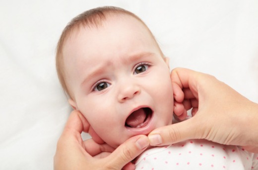 merangsang pertumbuhan gigi bayi